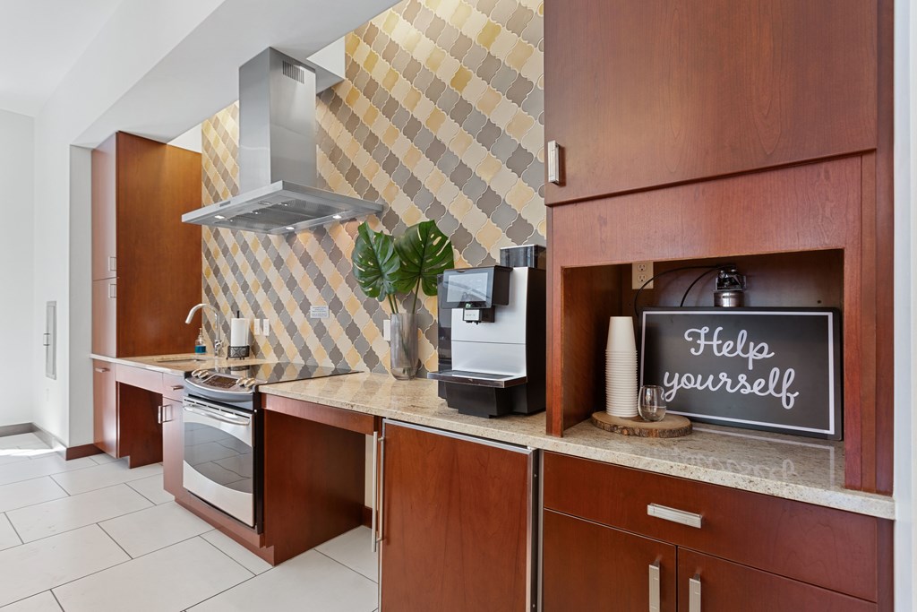 a kitchen with a counter with a sign that says help yourself