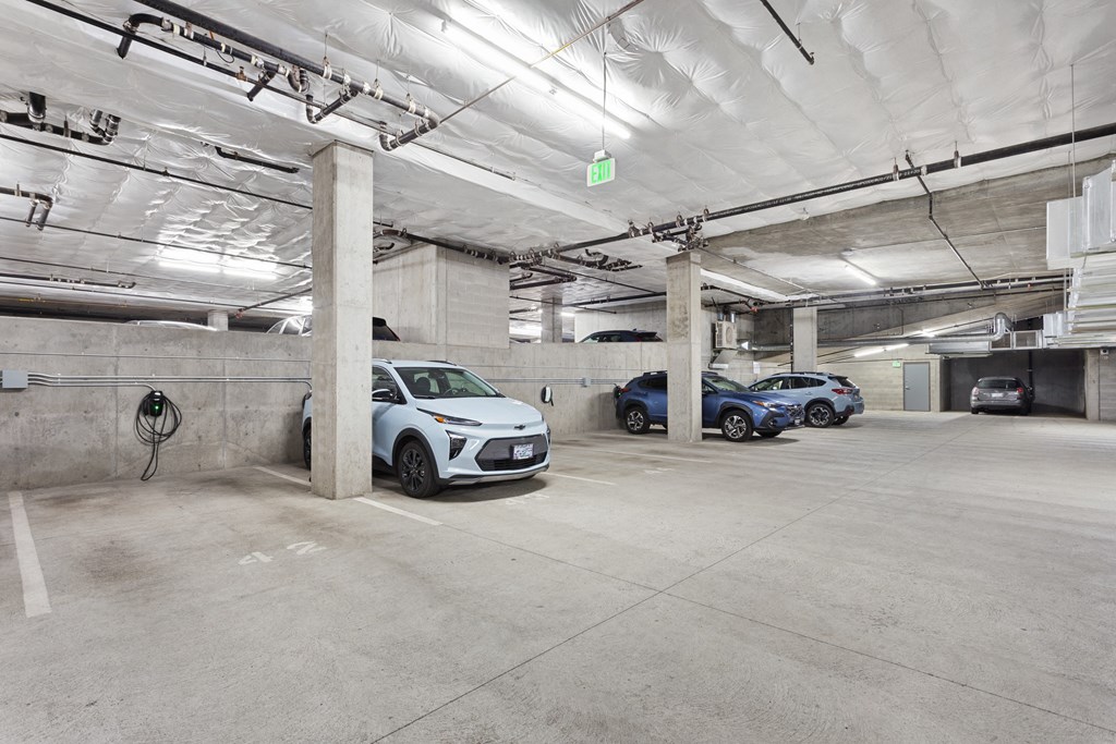 parking spaces in a parking garage with cars