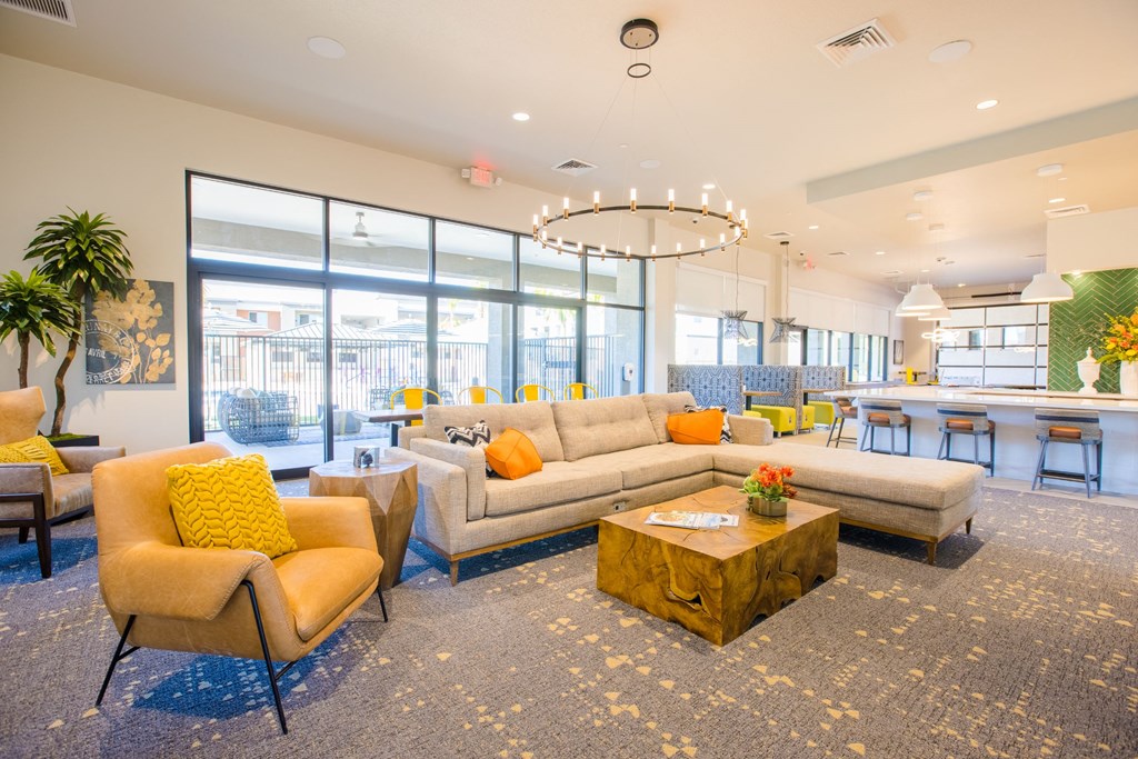 a living room with couches and chairs and a table