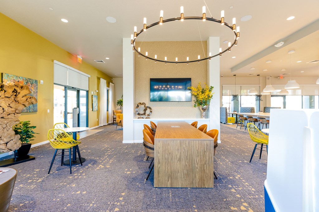 a dining room with a table and chairs in a lobby