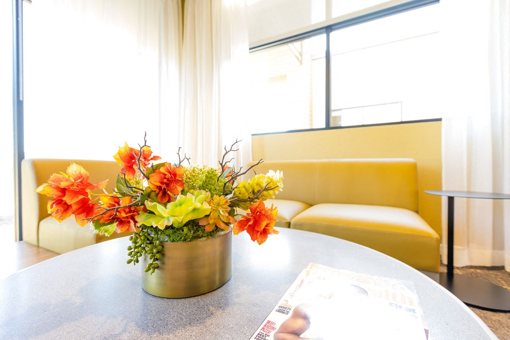 a vase of flowers on a table in a room