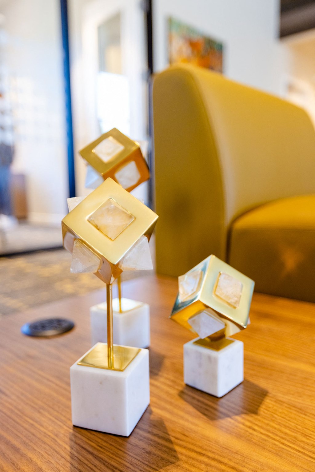 a group of geometric statues on a table in a living room
