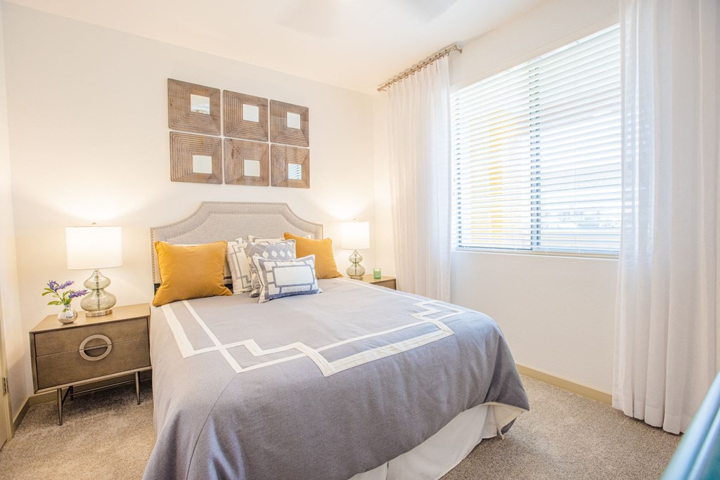 One BR Apartment In Gilbert, AZ - Spacious Bedroom With Carpet Flooring, Window, And Central Air.