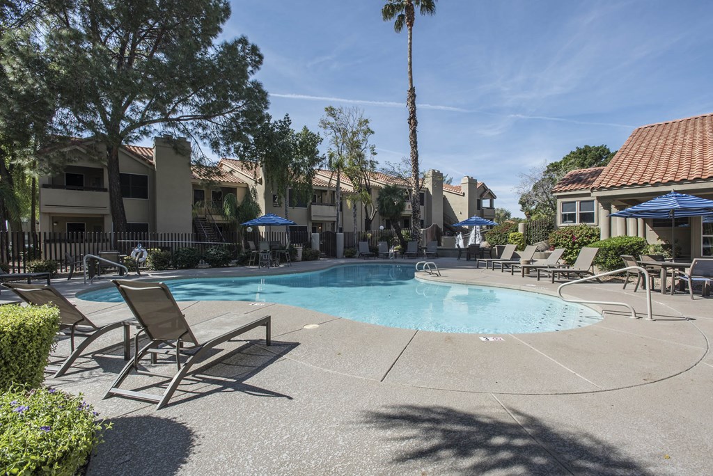 Apartments in Ahwatukee, Phoenix, AZ - Pacific Bay Club - Resort-Style Swimming Pool Surrounded By Lounge Chairs and Umbrellas