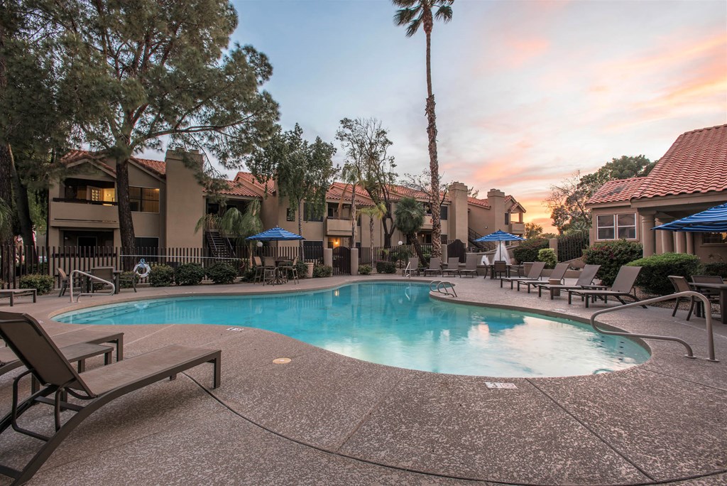 Apartments in Ahwatukee, Phoenix, AZ - Pacific Bay Club - Resort-Style Swimming Pool Surrounded By Lounge Chairs and Umbrellas