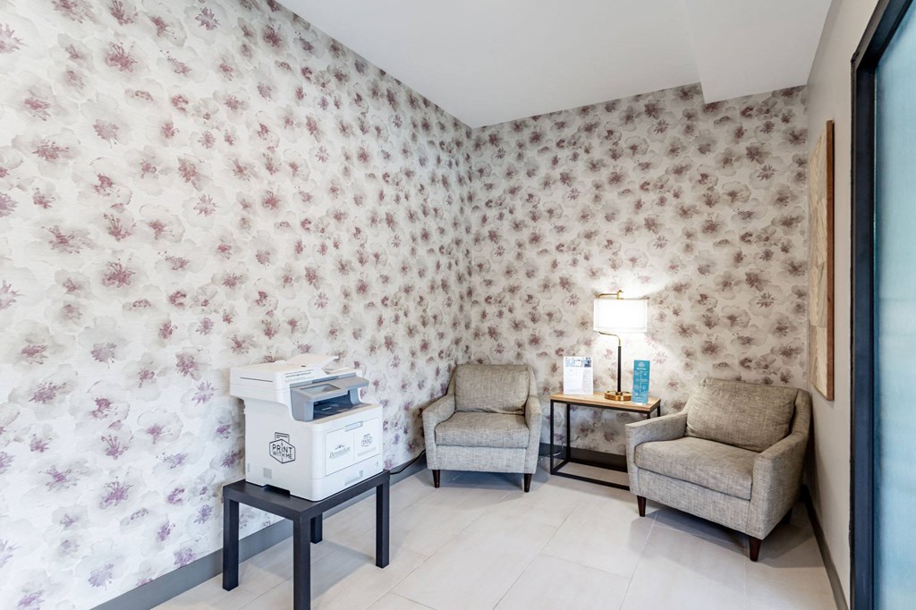 a room with two chairs and a printer