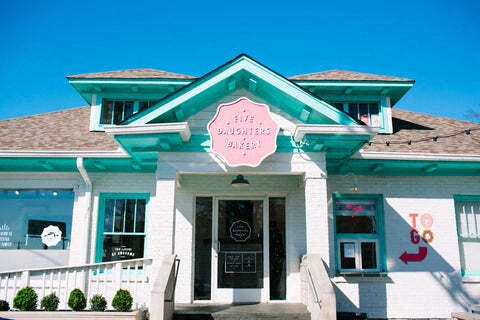 a blue and white building with a sign on the front