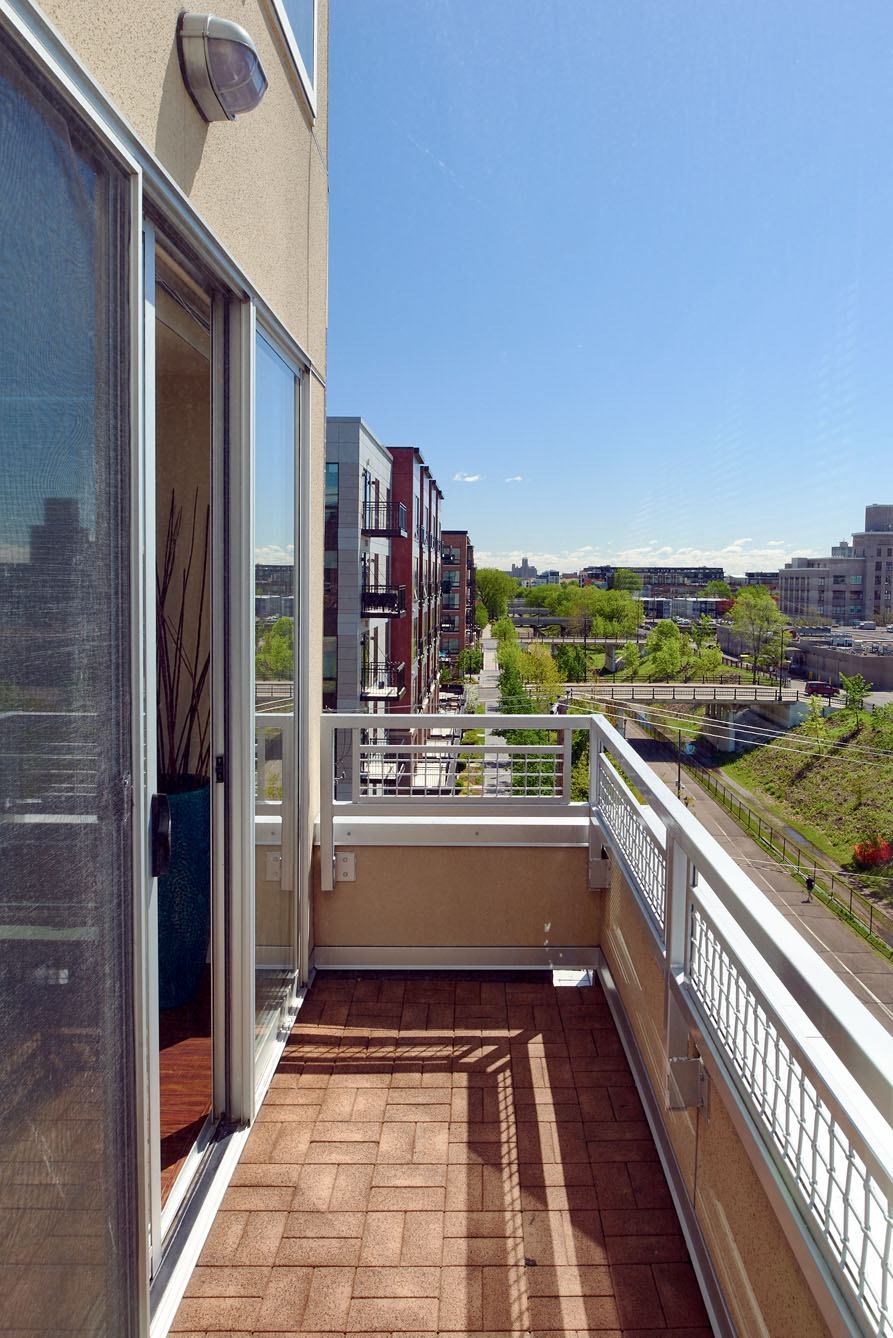 a balcony with a view of the city