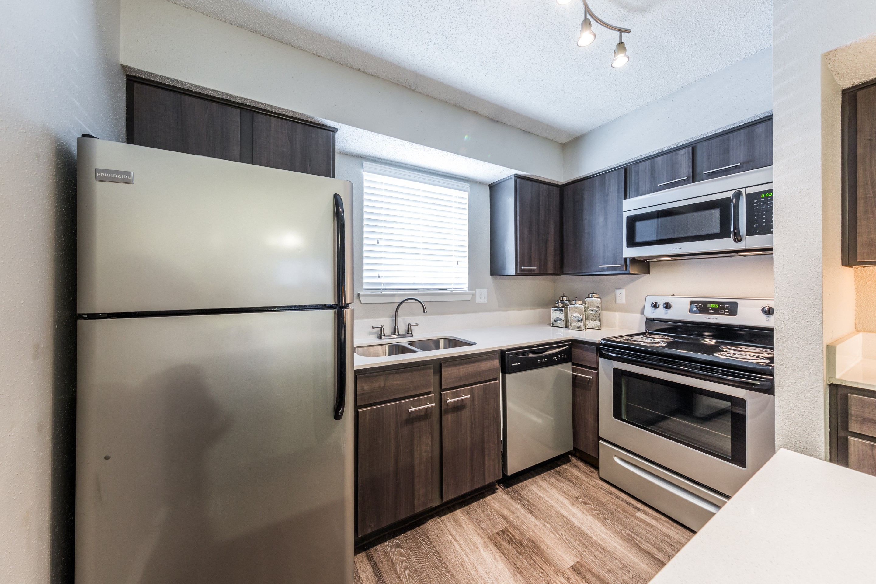 updated kitchen with stainless steel appliances