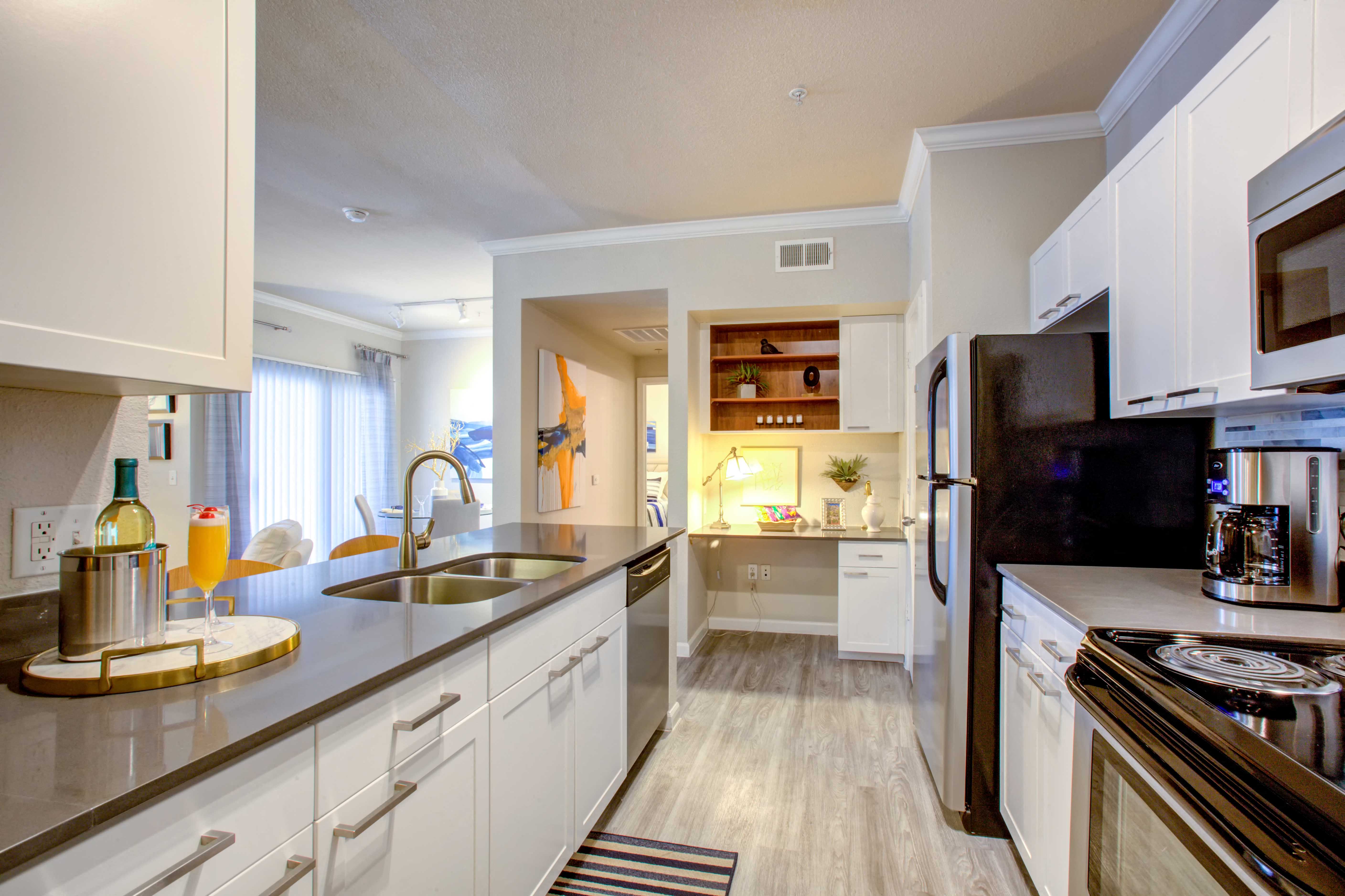 North Phoenix AZ Apartments for Rent - Fully Equipped Kitchen with Modern Interiors and Convenient Amenities Such As Fridge, Stove, and Microwave