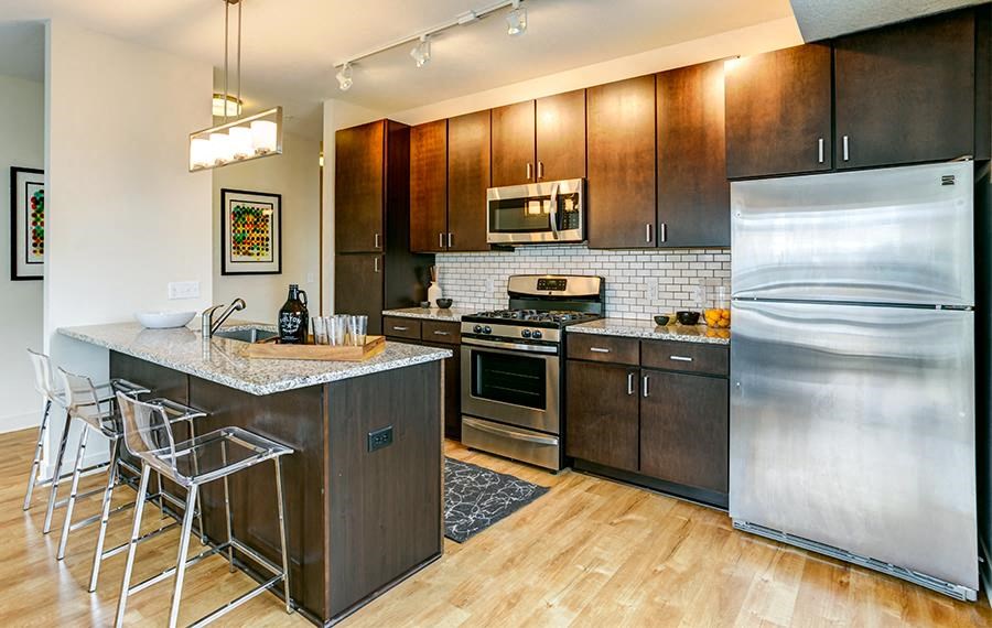 a kitchen with stainless steel appliances and a counter top