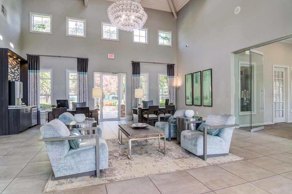 Woodstock, GA Apartments – Lea Woodstock – clubhouse with high ceilings, plus couches and beautiful chandelier