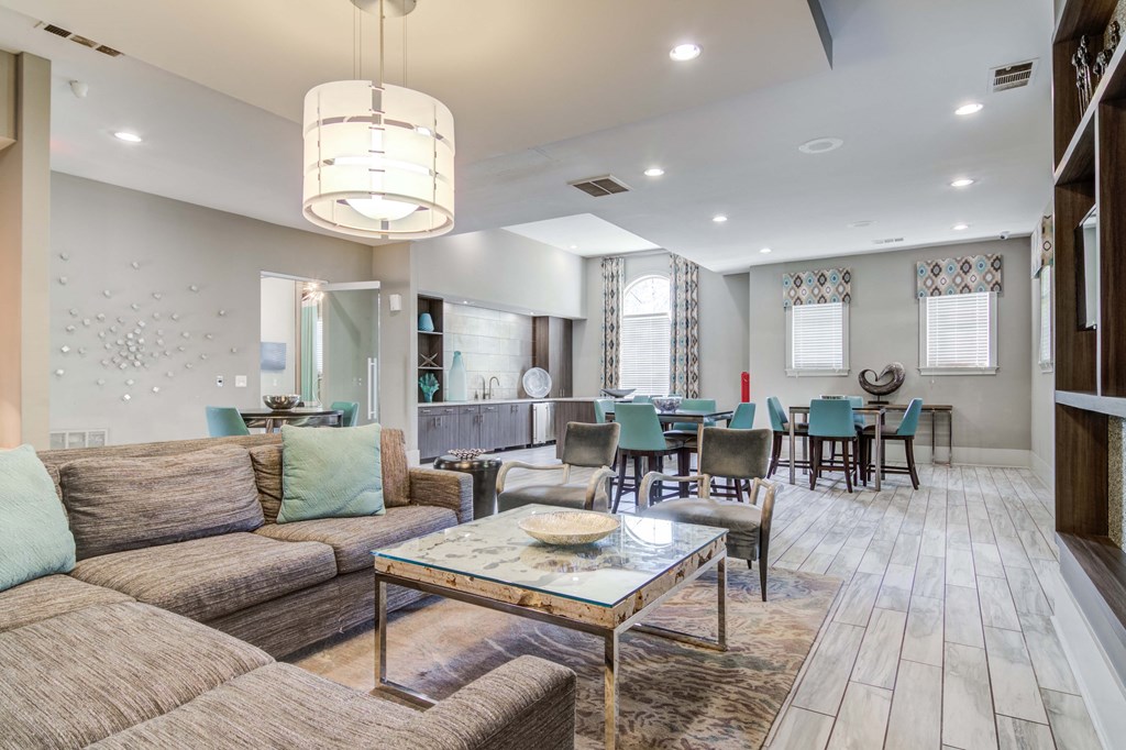 Pet-Friendly Apartments in Woodstock, GA – Lea Woodstock – clubhouse with seating and coffee table and chandelier