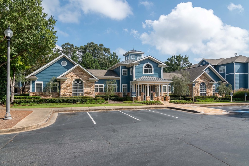 Apartments In Woodstock for Rent – Lea Woodstock – exterior of leasing office and view of parking lot