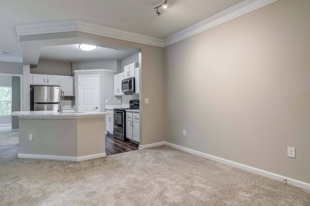 Apartments In Woodstock for Rent – Lea Woodstock – dining room area with plush carpeting with a v iew of the kitchen