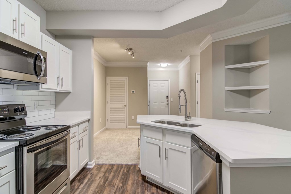 Apartments In Woodstock for Rent – Lea Woodstock – Luxury kitchen with kitchen island, stainless steel appliances, white cabinets.