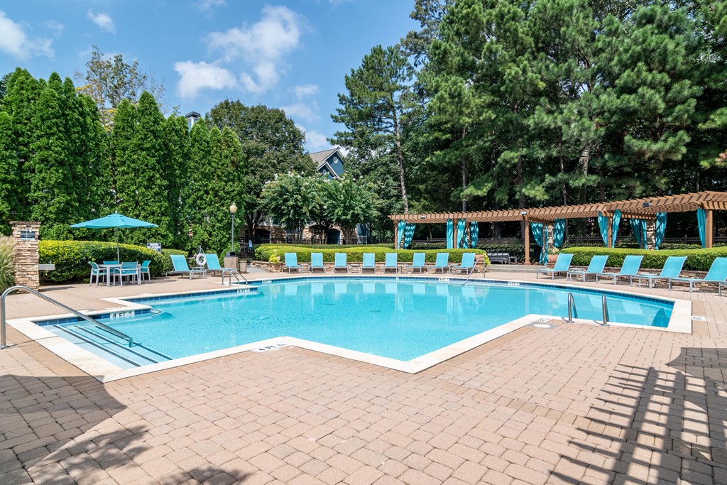 Woodstock, GA Apartments – Lea Woodstock –  resort style swimming pool and sundeck with pool chairs