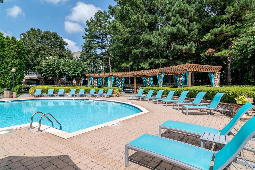 Apartments In Woodstock for Rent – Lea Woodstock –  resort style swimming pool with sundeck and lots of pool chairs