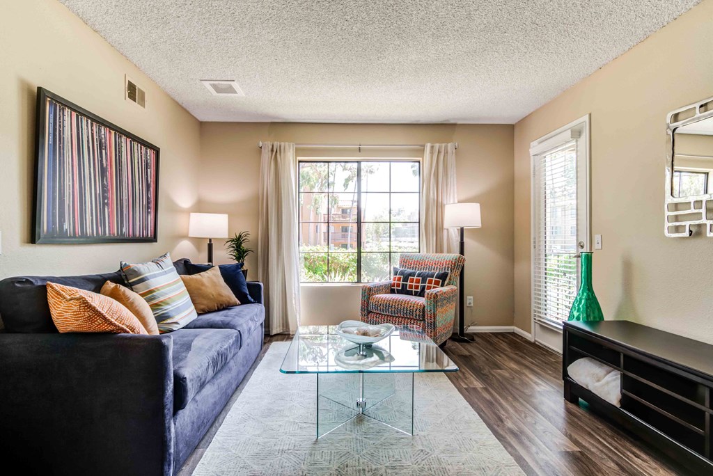 1-Bedroom Apartments in La Jolla, CA - Mirada at La Jolla Colony - Spacious Living Room with Wood-Style Flooring and a Large Window