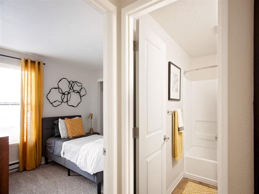 a bedroom with a bed and a closet