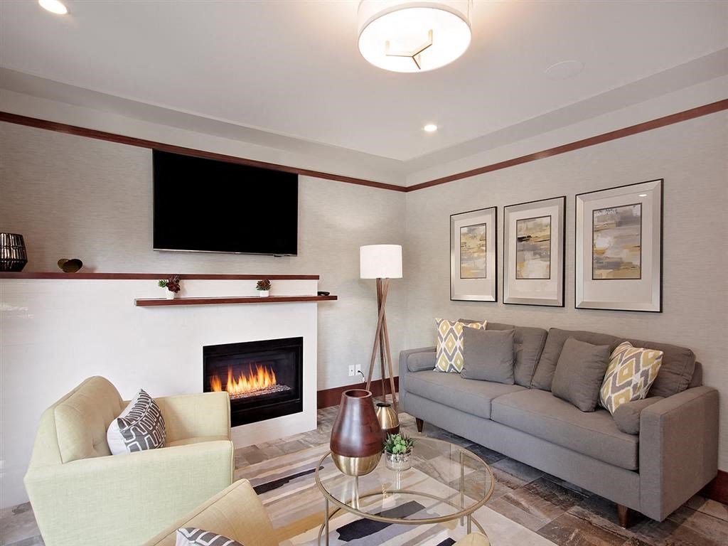 a living room with a couch and a fireplace