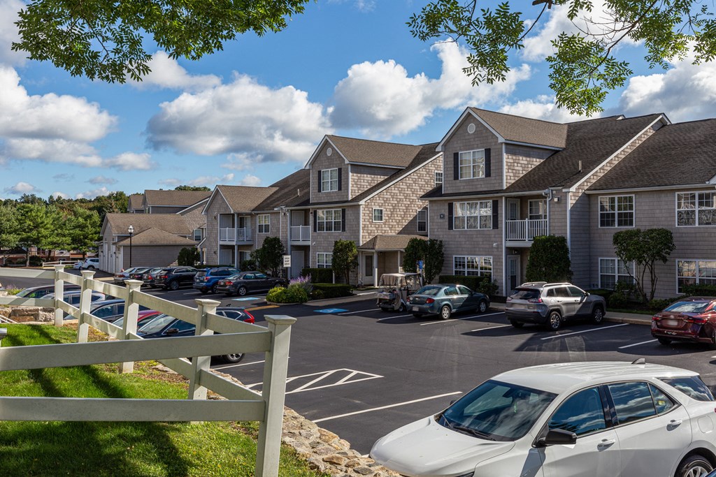 Orchards Apartments Marlborough ma apartment loft style apartments photo of apartment building exteriors with tan siding next to parking lot and landscaping