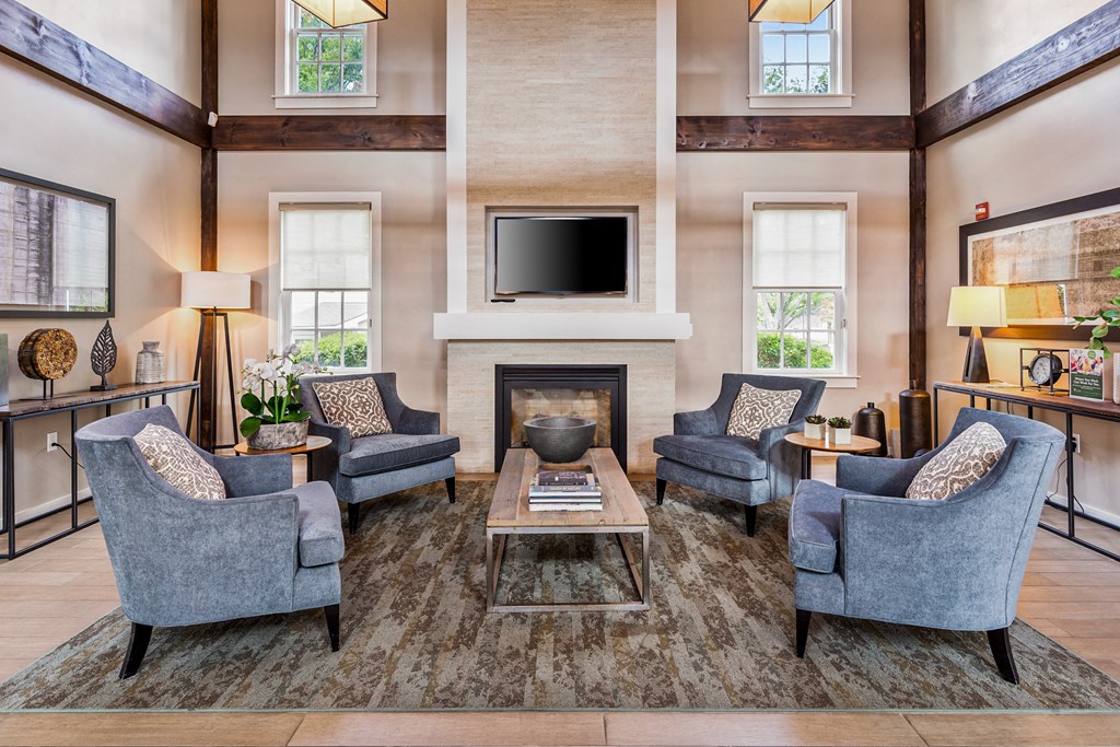 Orchards Apartments Marlborough ma apartment loft style apartments photo of  clubhouse lounge area with large fireplace and mantle with high ceiling and modern furniture