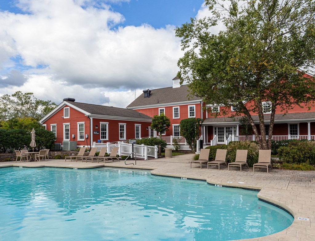 Orchards Apartments Marlborough ma apartment loft style apartments photo of  pool with lounge chairs and red siding clubhouse in background