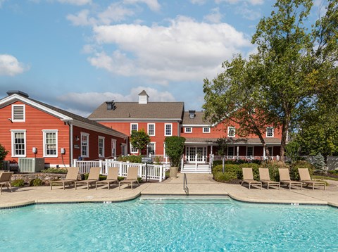 Marlborough, MA, Apartments Near Apex Entertainment - Orchards Apartments - Swimming Pool With Lounge Chairs, White Fencing, Landscaped Walkways, and Mature Trees.