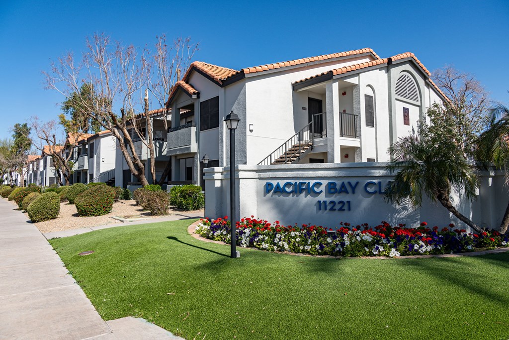 a sign for the dock bay club in front of a building