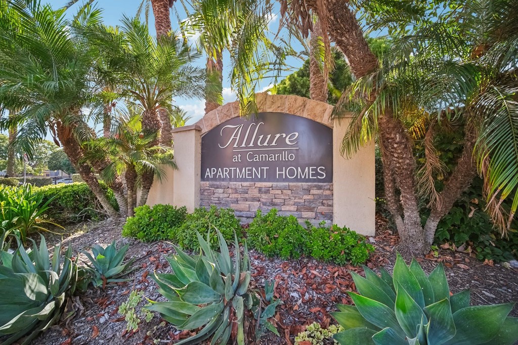 the sign at the entrance to allure apartments