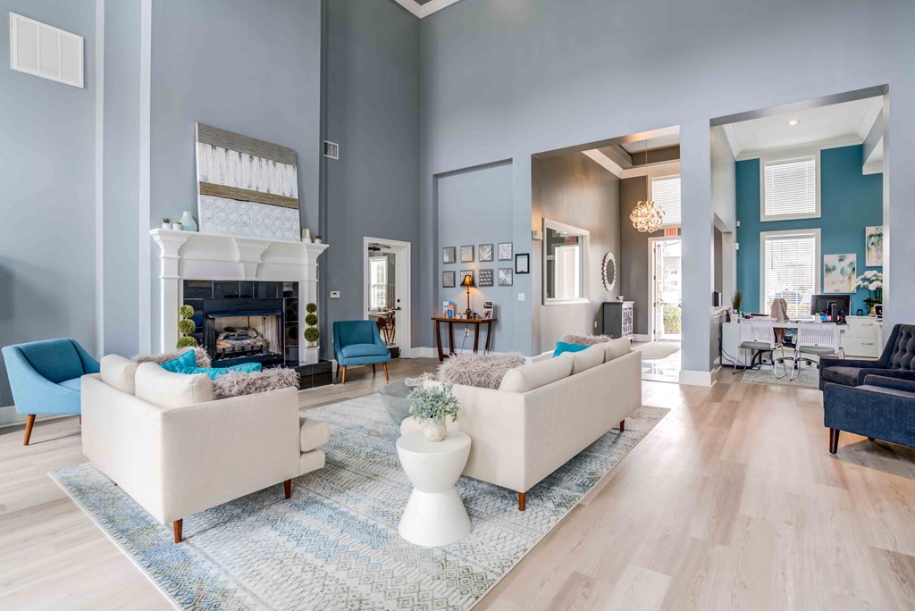 a living room with couches and a fireplace