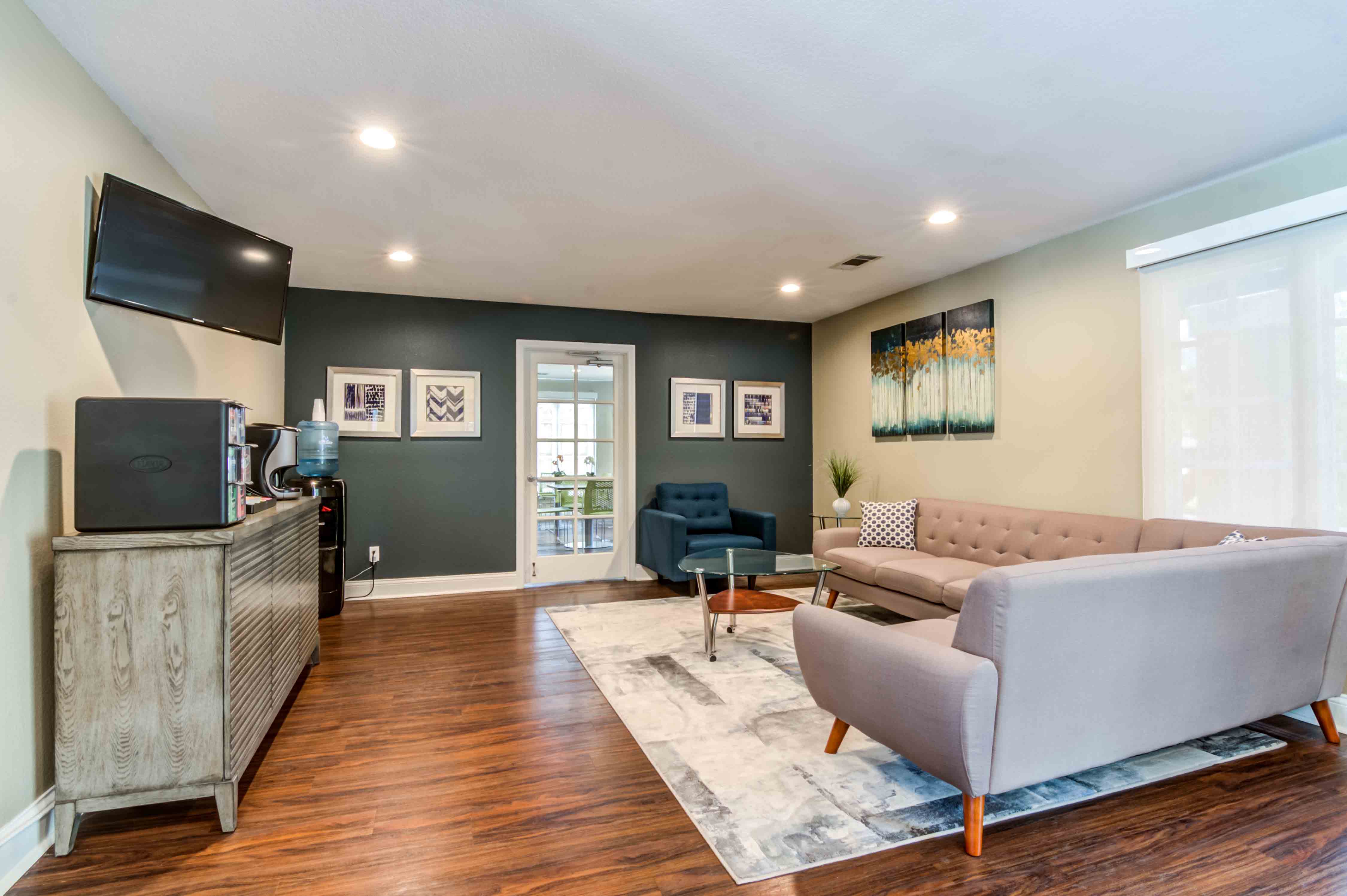 a living room with a couch and a tv