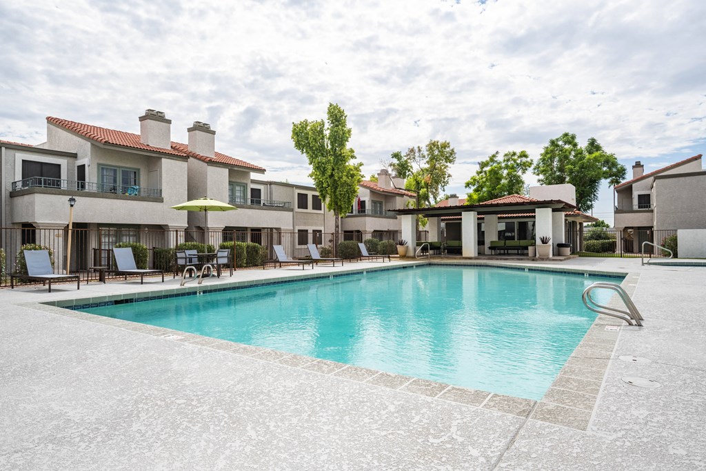Two Bedroom Apartments in Scottsdale, AZ - The Sycamore at Scottsdale - Pool with Gated Entry, Lounge Seating, Umbrellas, and Nice Landscaping