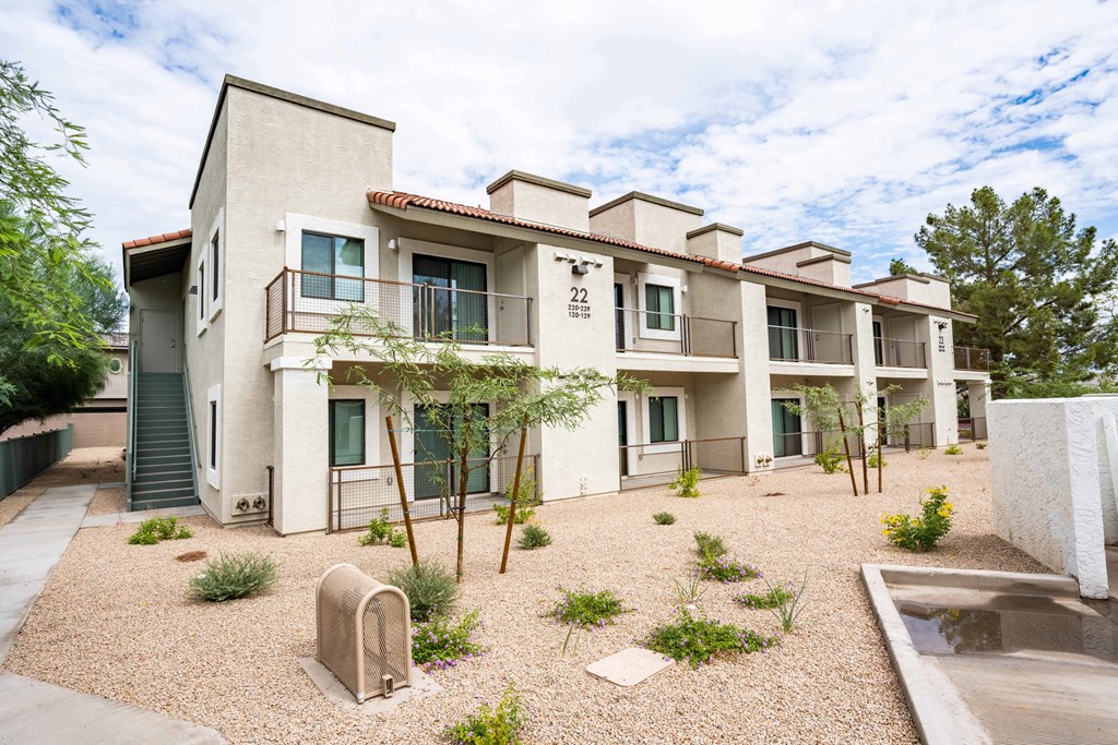 Three Bedroom Apartments in Scottsdale, AZ - The Sycamore at Scottsdale - Apartment Building Exterior with Private Balconies/Patios and Landscaping