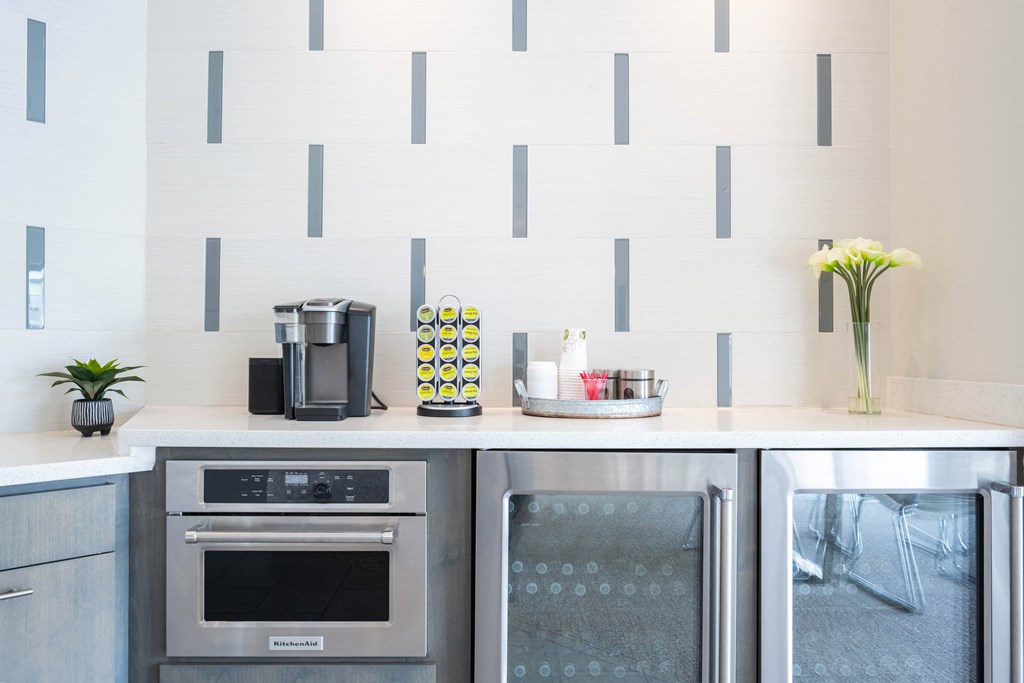 a kitchen with stainless steel appliances and a white counter top