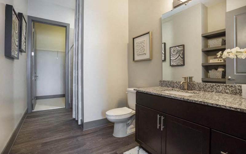 Octave Apartments in Nashville Tennessee photo of bathroom with hardwood flooring