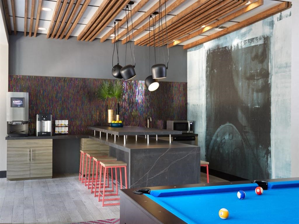 a pool table and a bar in a room