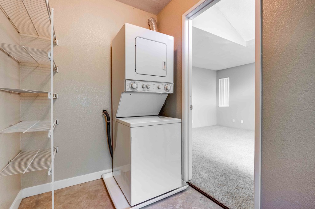 a laundry room with a washer and dryer in a closet