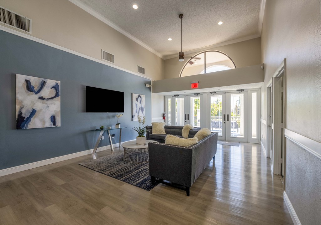 Coconut Creek Apartments – Waterview at Coconut Creek – clubhouse with sitting area and tv