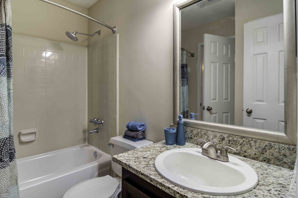 Wood Pointe Apartment Homes in Marietta Georgia photo of a bathroom with a sink toilet and bathtub