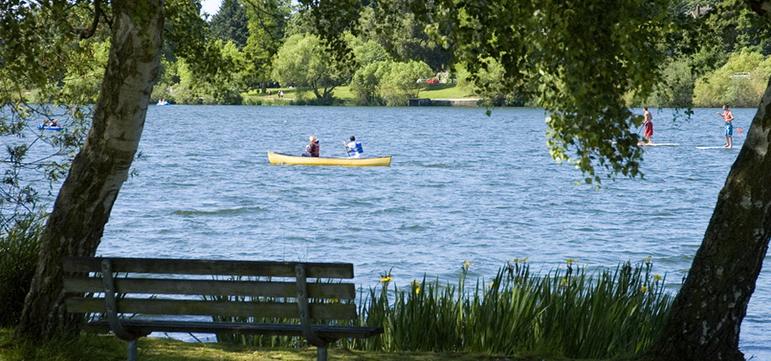 two people in a boat on a lake