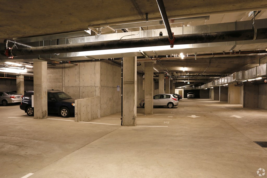 a parking garage with cars in it