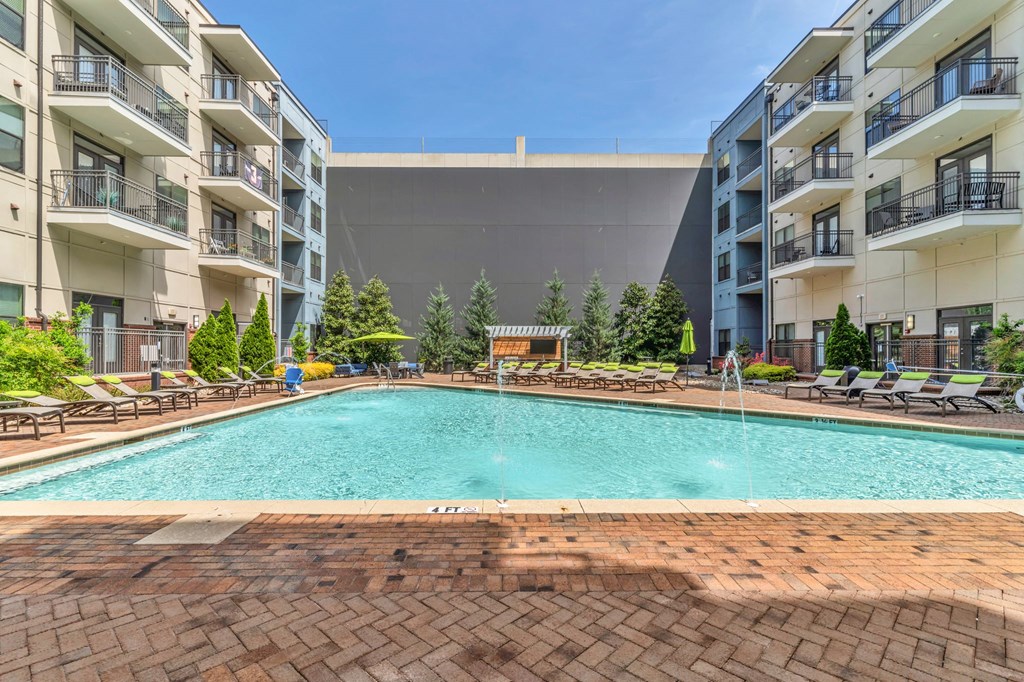 Pet-Friendly Apartments in Nashville, TN- Octave Apartments- resort style swimming pool with sundeck and lounge chairs
