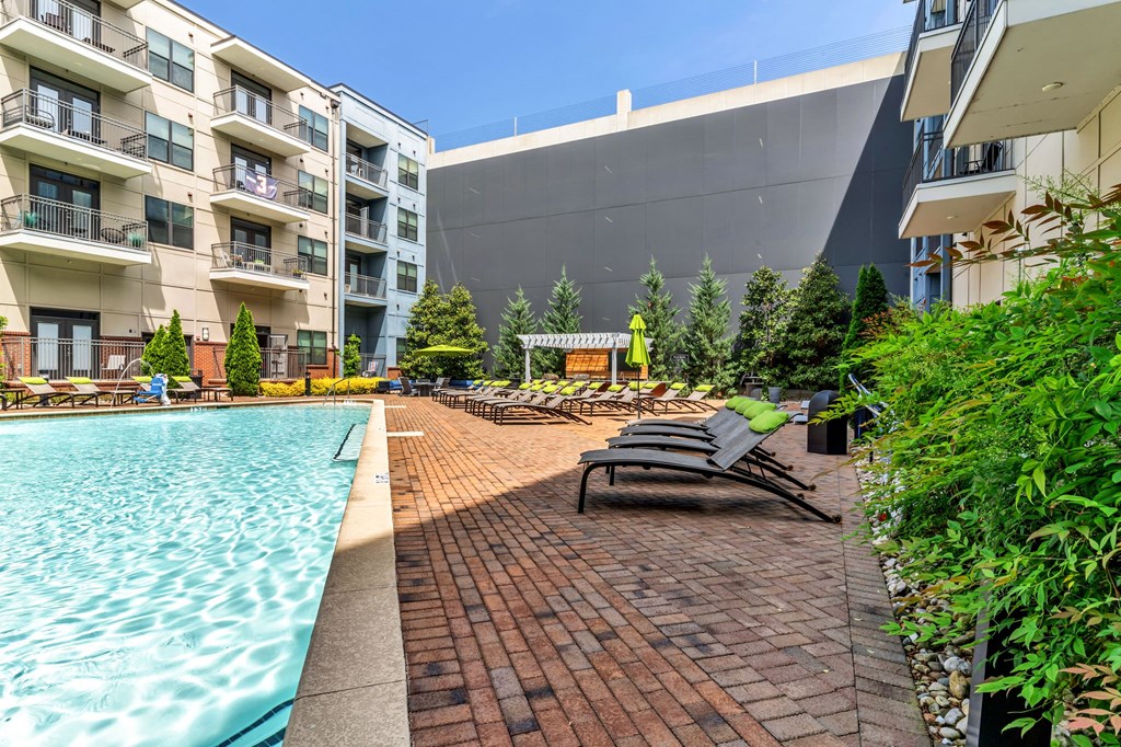 Pet-Friendly Apartments in Nashville, TN- Octave Apartments- resort style swimming pool with sundeck and lounge chairs
