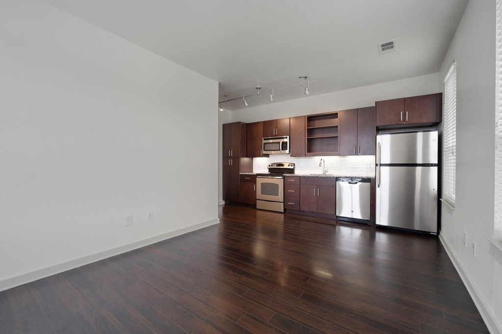 12 South Apartments - Nashville TN - kitchen with dark wood cabinets and stainless steel appliances