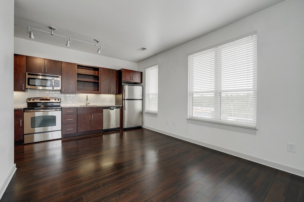 12 South Apartments - Nashville TN - kitchen with dark wood cabinets and stainless steel appliances