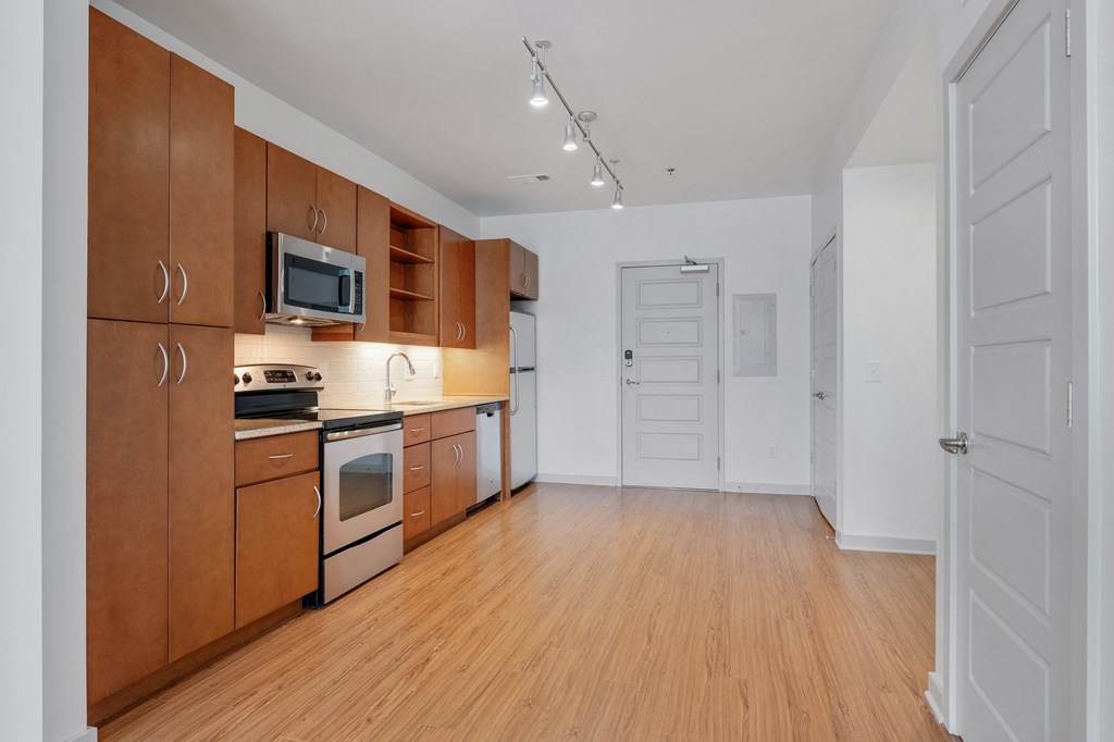 12 South Apartments - Nashville TN - kitchen with dark wood cabinets and stainless steel appliances