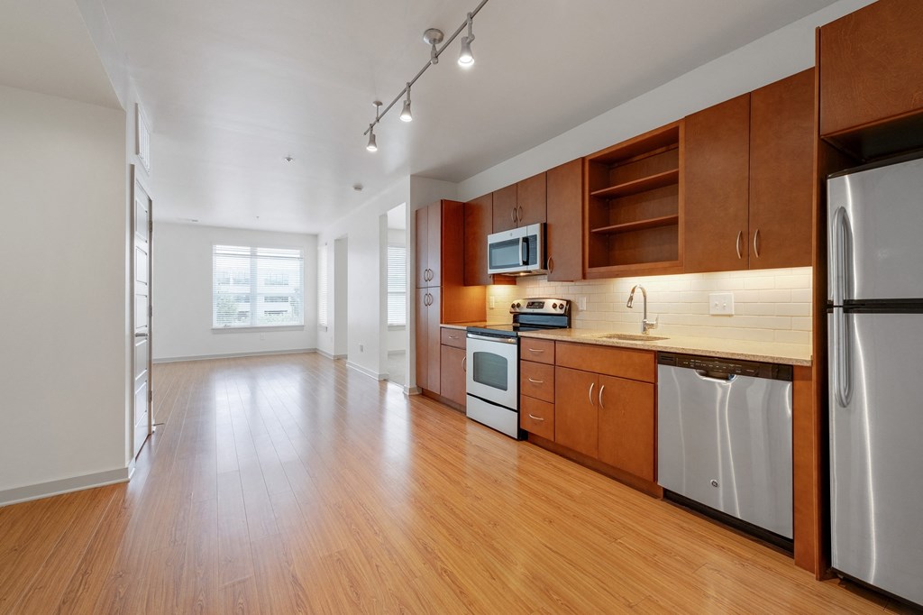 12 South Apartments - Nashville TN - kitchen with dark wood cabinets and stainless steel appliances