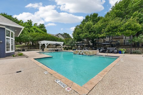 A pool with a no diving sign on the side.